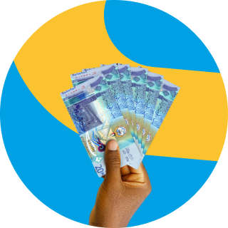 Kuwaiti dinar notes in hand